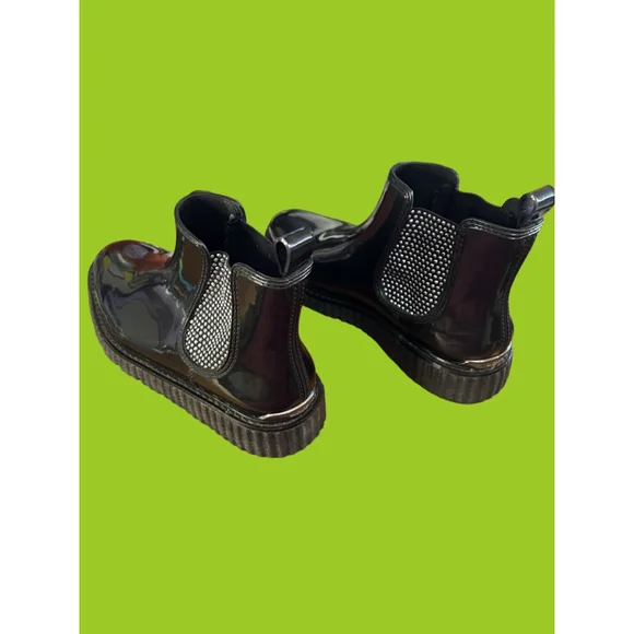 Women's Michael Kors black patent Lulu PVC Chelsea boot with stud accents.